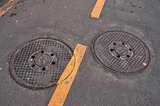 sewer drain or manhole needs repair