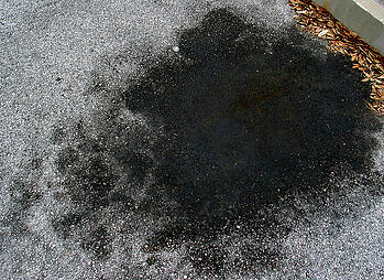 remove oils stains from driveways