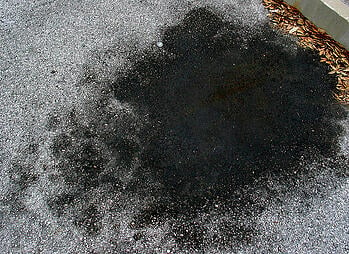 remove oils stains from driveways